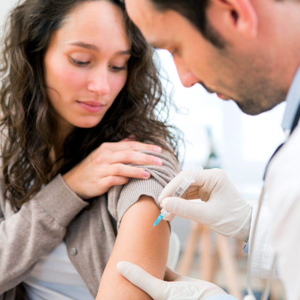 RSV Vaccine & Others at Pregnancy | Conceive NJ Pregnant woman receiving a vaccine